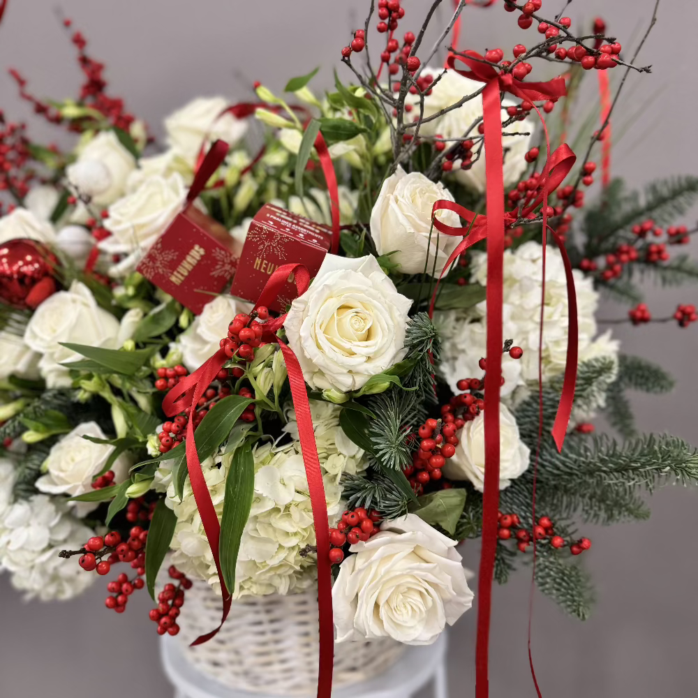 White and red arrangement in a white basket.