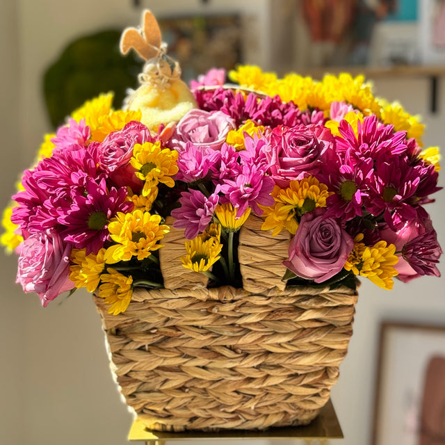 Perple and yellow mums, roses and bunny in the basket for Easter.