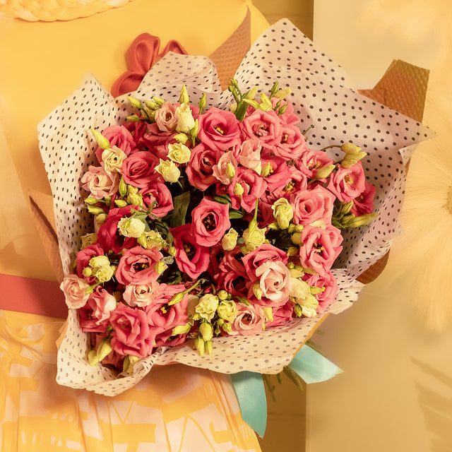 Bouquet of lisianthus in dots wrapping paper