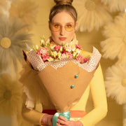 Lisianthus bouquet in a girl's arms