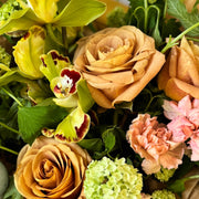 Green Easter floral centerpiece with fresh blooms.