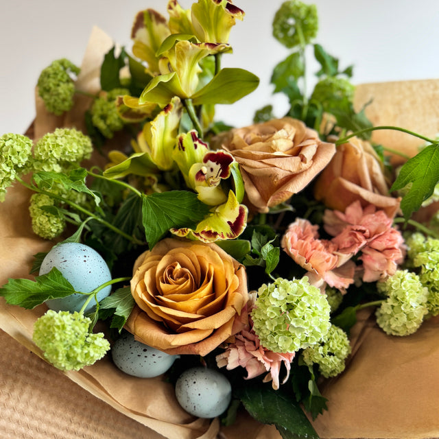 Bouquet with green cymbidium orchids, viburnum.