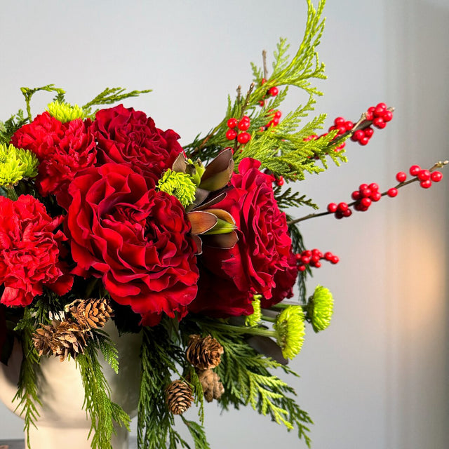 Red and green bouquet in a vase