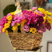 Purple and yellow mums in the basket.