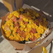 Yellow roses in the kraft cone box