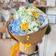 Blueberry Sunshine bouquet with roses, hydrangea, and stock flowers