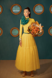 Bouquet of tulips in the arms of a girl in yellow