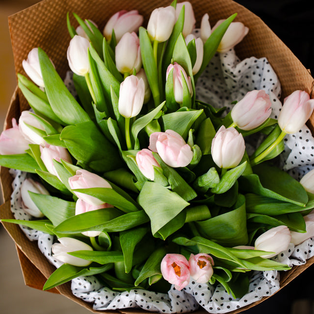Bouquet of tulips wrapped in Kraft paper