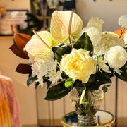 Elegant Winter Grace white floral centerpiece styled for a dining table, perfect for Thanksgiving or Christmas celebrations.