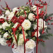 White and red arrangement in a white basket. 