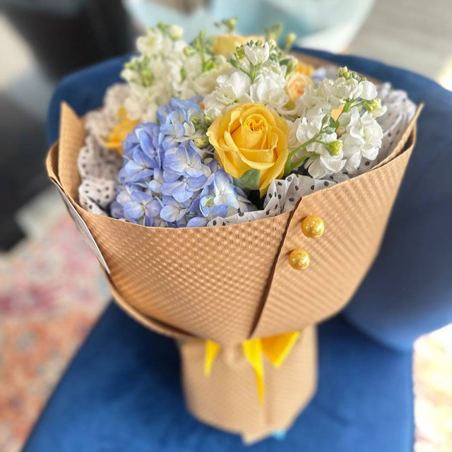 bouquet with roses, hydrangea, and stock flowers