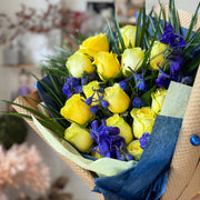 Close-up of Blue & Gold Cheers Bouquet with vibrant yellow and blue flowers