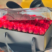 Box of red roses with a blurred background