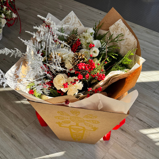 Flower bouquet in the delivery box with red details. 