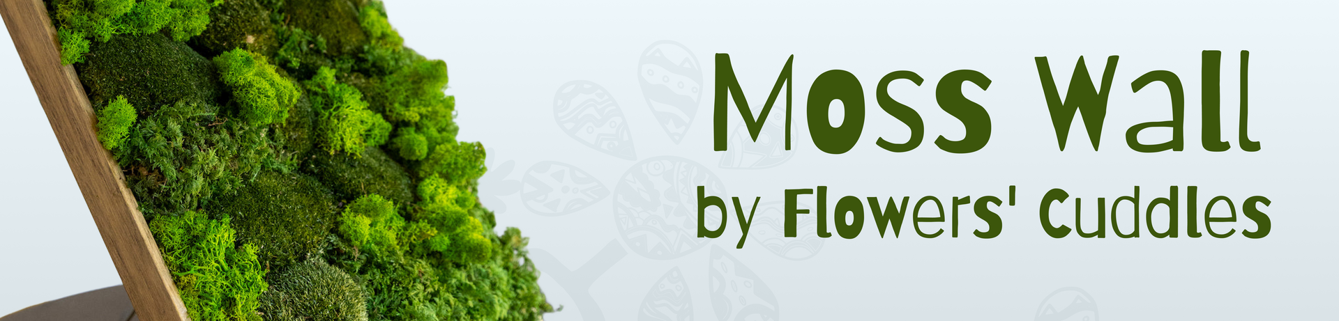 Moss wall with 'Moss Wall by Flowers' Cuddles' text on a white background