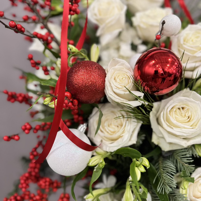 Close view to gift basket with fresh flowers.