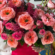 Romantic bouquet with Expression roses, garden roses, spray roses, astilbe, and cascading amaranthus.