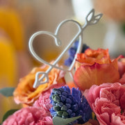 Heart Pop floral arrangement with roses, hyacinth, and eucalyptus