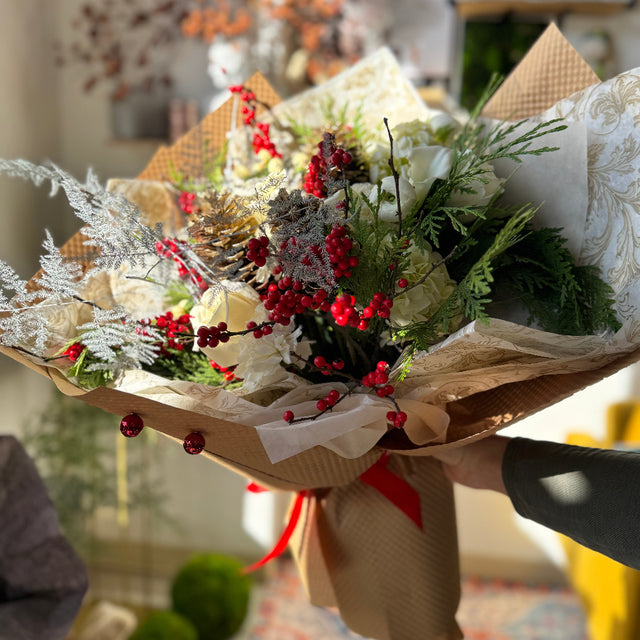 Flowers for holiday season - white roses, ilex and more. 