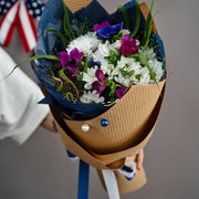 Gentle garden-style Independence Day flower arrangement wrapped in eco-friendly paper