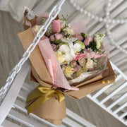 Hand-tied luxury bouquet with pastel pink spray roses and orchids.