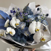 Luxury bouquet with blue accents and white orchids