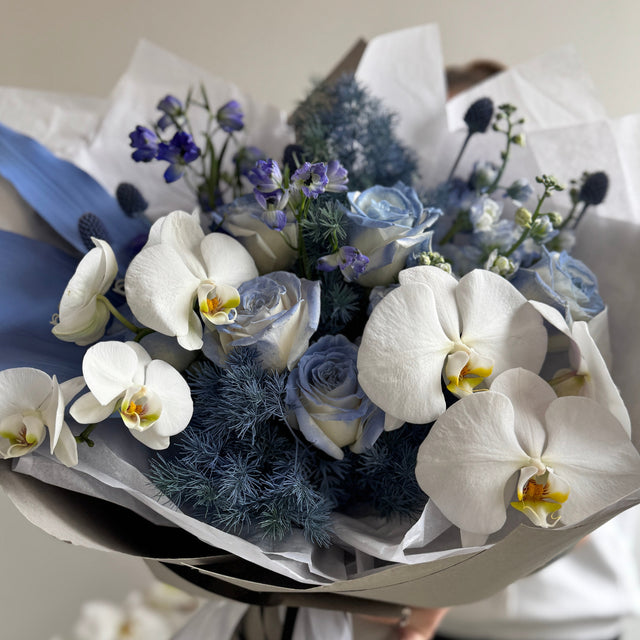 Luxury bouquet with blue accents and white orchids