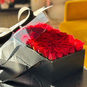 Modern Valentine’s Day red rose arrangement in a black box