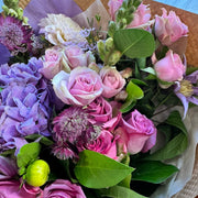 mix of lavender hydrangea, lavender roses, delicate soft pink spray roses, clematis.