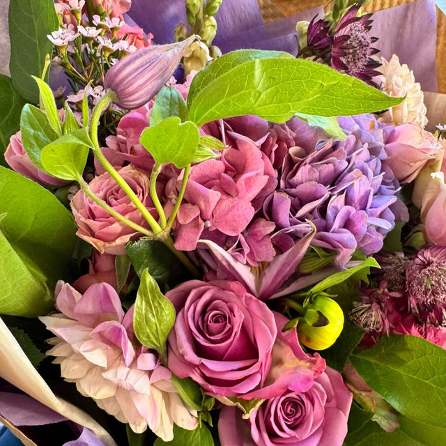 Bouquet featuring lavender hydrangea, lavender roses, soft pink spray roses