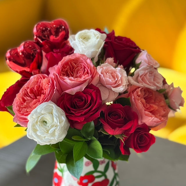 Romantic rose and ranunculus arrangement designed for Valentine’s Day gifting
