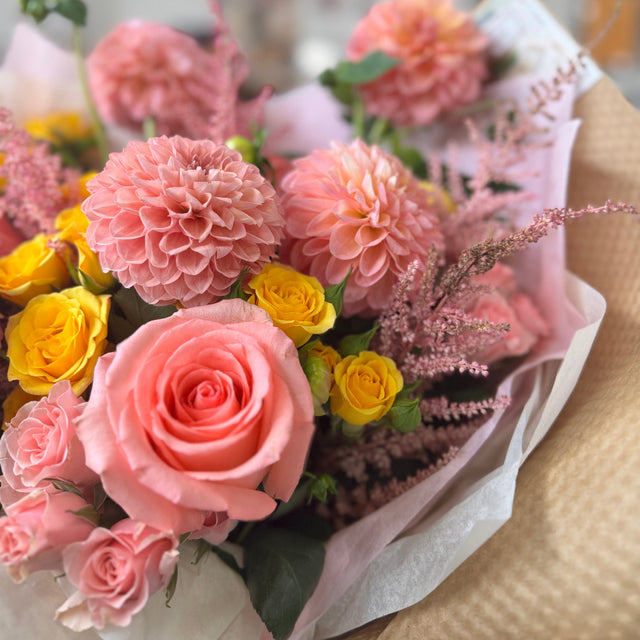 Blooming dahlias with delicate petals in warm seasonal tones