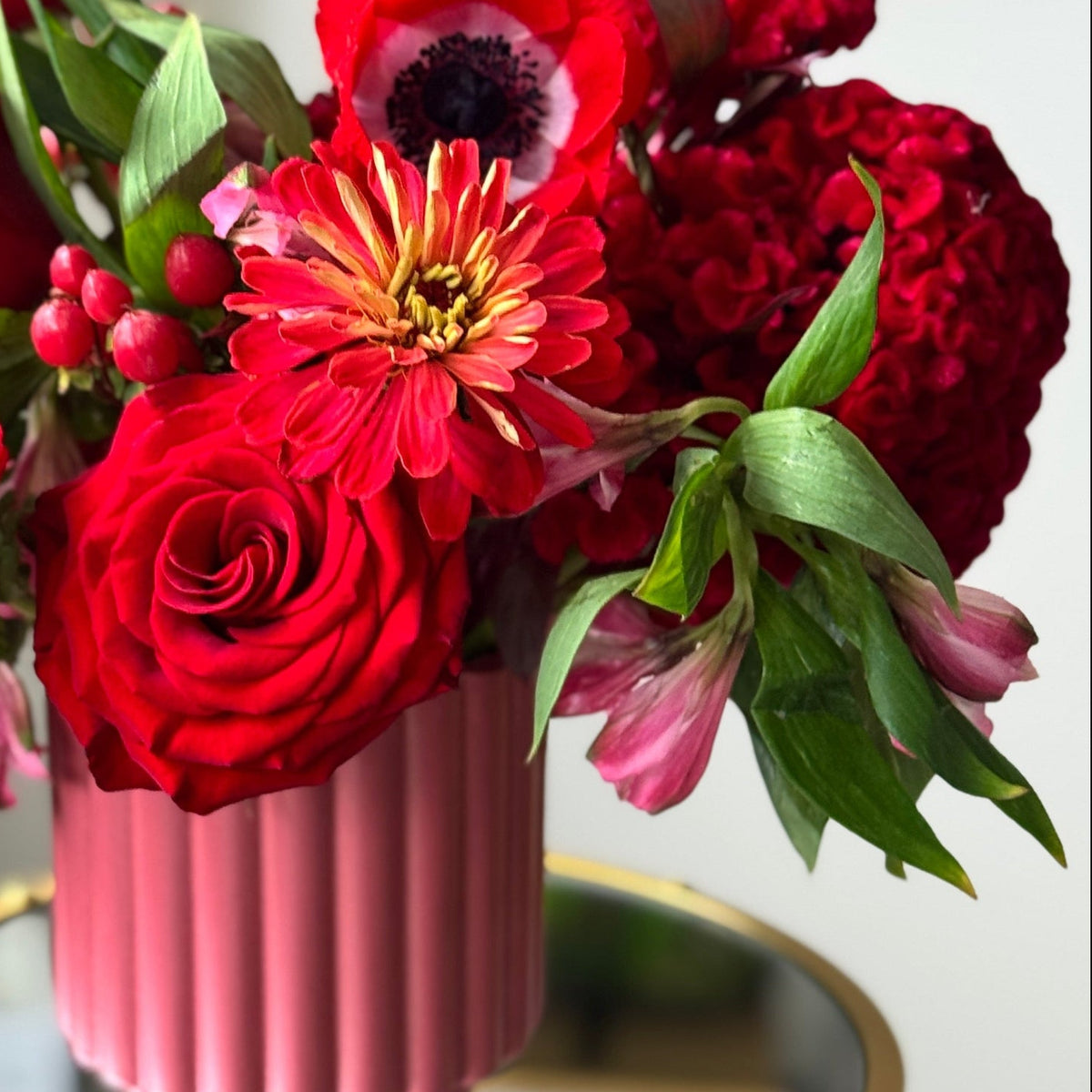 Velvet Romance Bouquet with roses, alstroemeria, hypericum berries, anemones, seasonal premium flowers, and greenery.