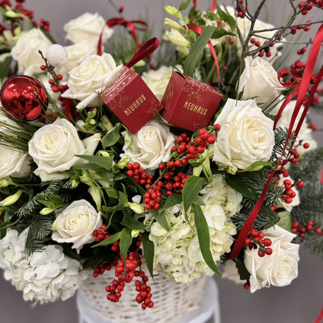 white and red flowers in he basket .