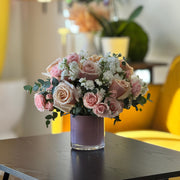 Romantic blush flower arrangement with roses, stock, and eucalyptus