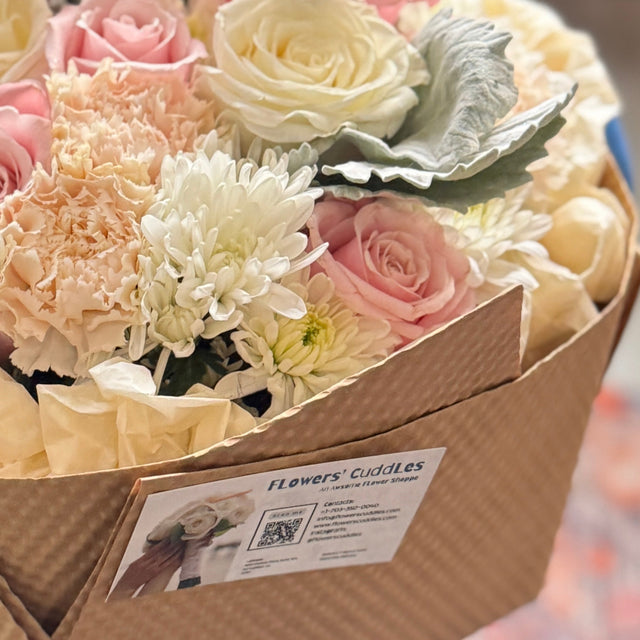 Eco-wrapped Sugar Rose bouquet in soft pink and white blooms