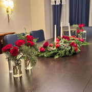 Modern holiday décor centerpiece with flowing S-shape and fresh greenery