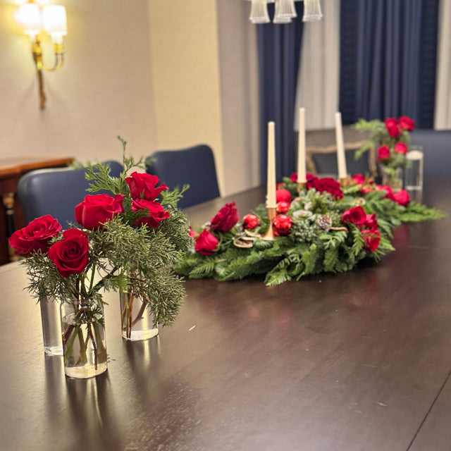 Modern holiday décor centerpiece with flowing S-shape and fresh greenery