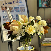 Winter Grace floral arrangement with white flowers and magnolia leaves adding timeless elegance to home décor.