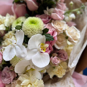 Top view of Lace & Roses bouquet showing delicate pink and white roses.