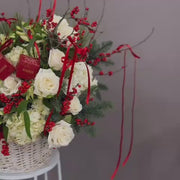 Video of Holiday gift basket with fresh flowers and ornaments.