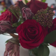 Rustic Flame floral arrangement with tulips, roses, yarrow, and ruscus by Flowers’ Cuddles, available for same-day delivery in the DMV area.