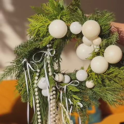 Elegant Winter Pearl wreath featuring white amaranthus, pearls, ornaments, and ribbon