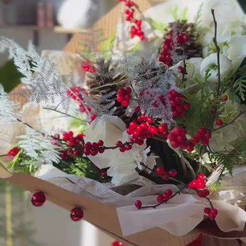 Video of Holiday Fresh flowers bouquet in white and red. 