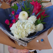 Fourth of July red, white, blue flower arrangement.
