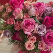 video of arrangement with pink roses and spray roses