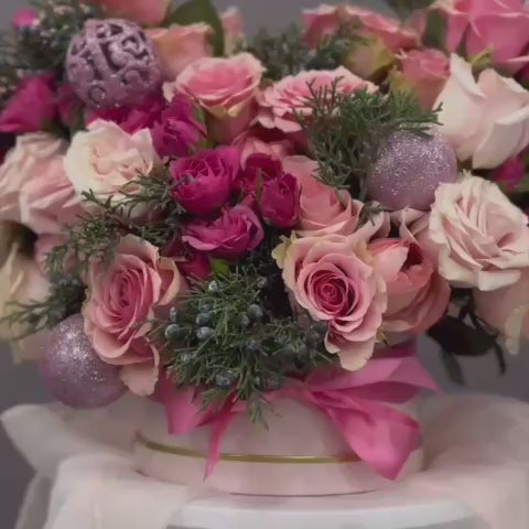 Pink holidays flowers with pink ornaments. 